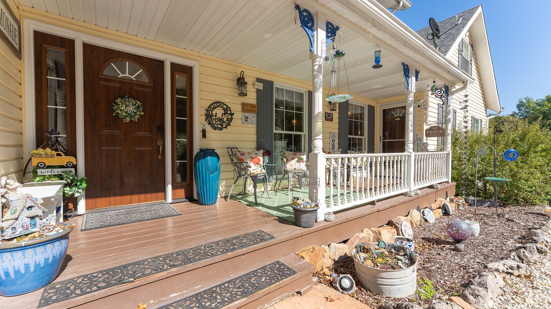 the front porch of the hummingbird inn camdenton