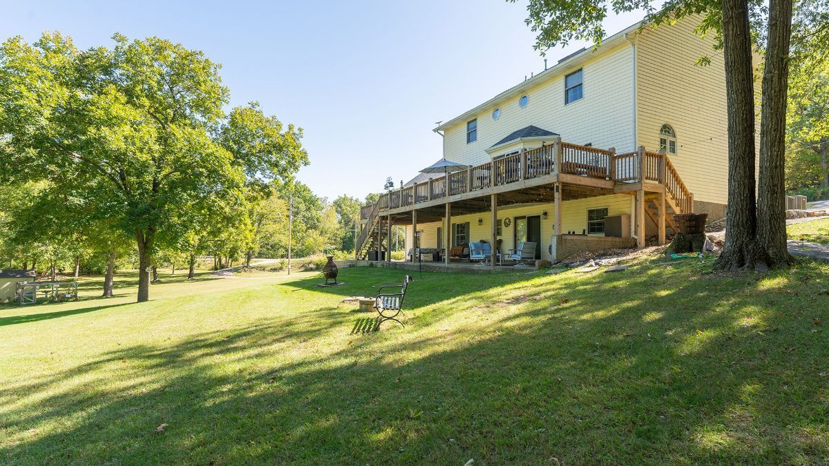 the back of our bed & breakfast with a view of the large deck