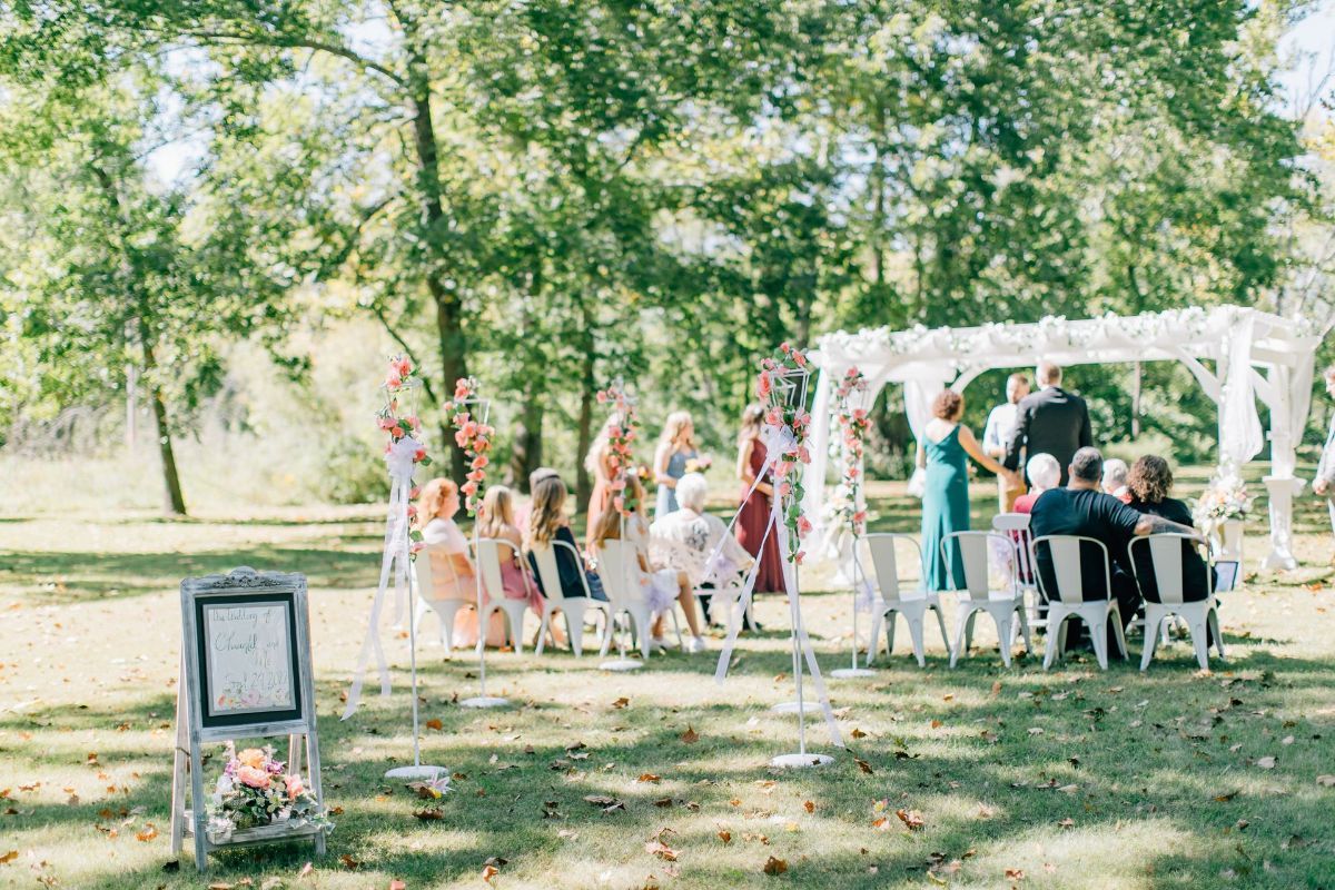 a wedding ceremony taking place in our large backyard