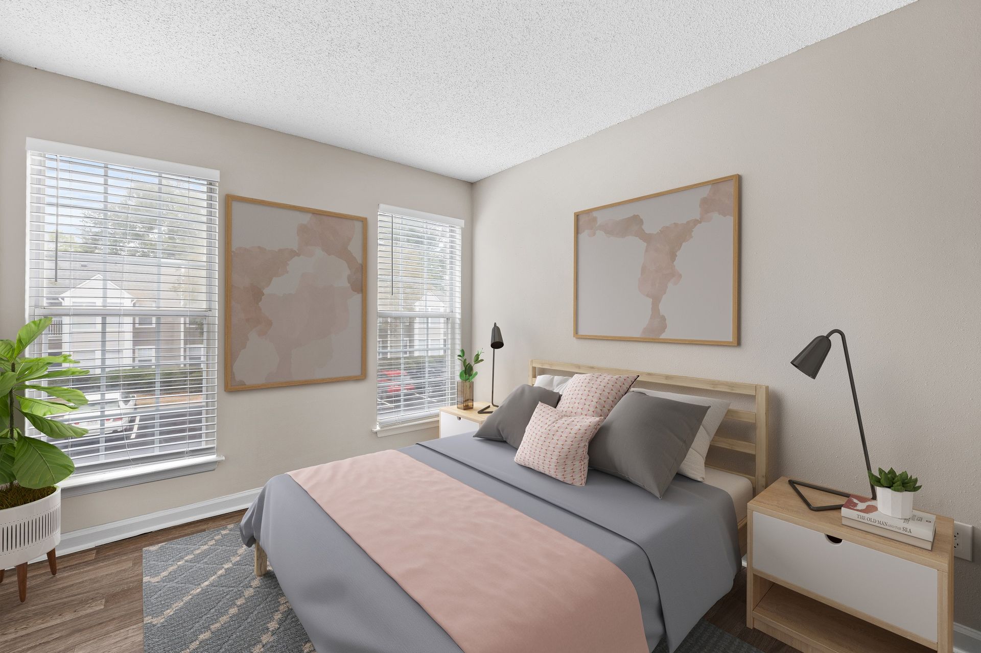 Bedroom with bed, windows, artwork, nightstands, and greenery at Station Heights in Alpharetta, GA.
