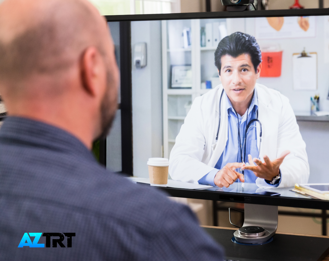 A man is talking to a doctor on a computer screen.