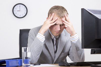 Frustrated at Desk | Contact Social Security Lawyer