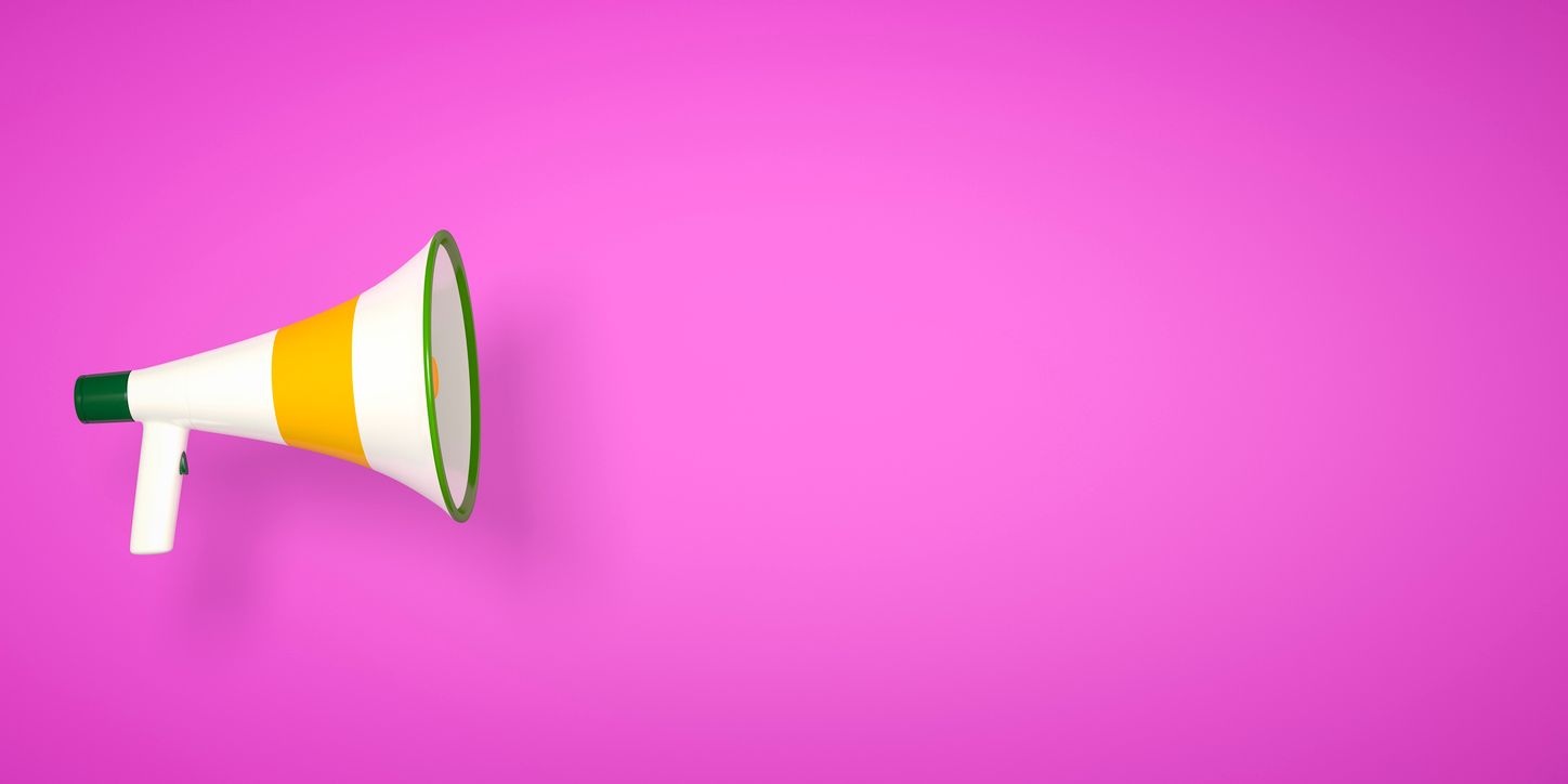 A megaphone on a pink background.