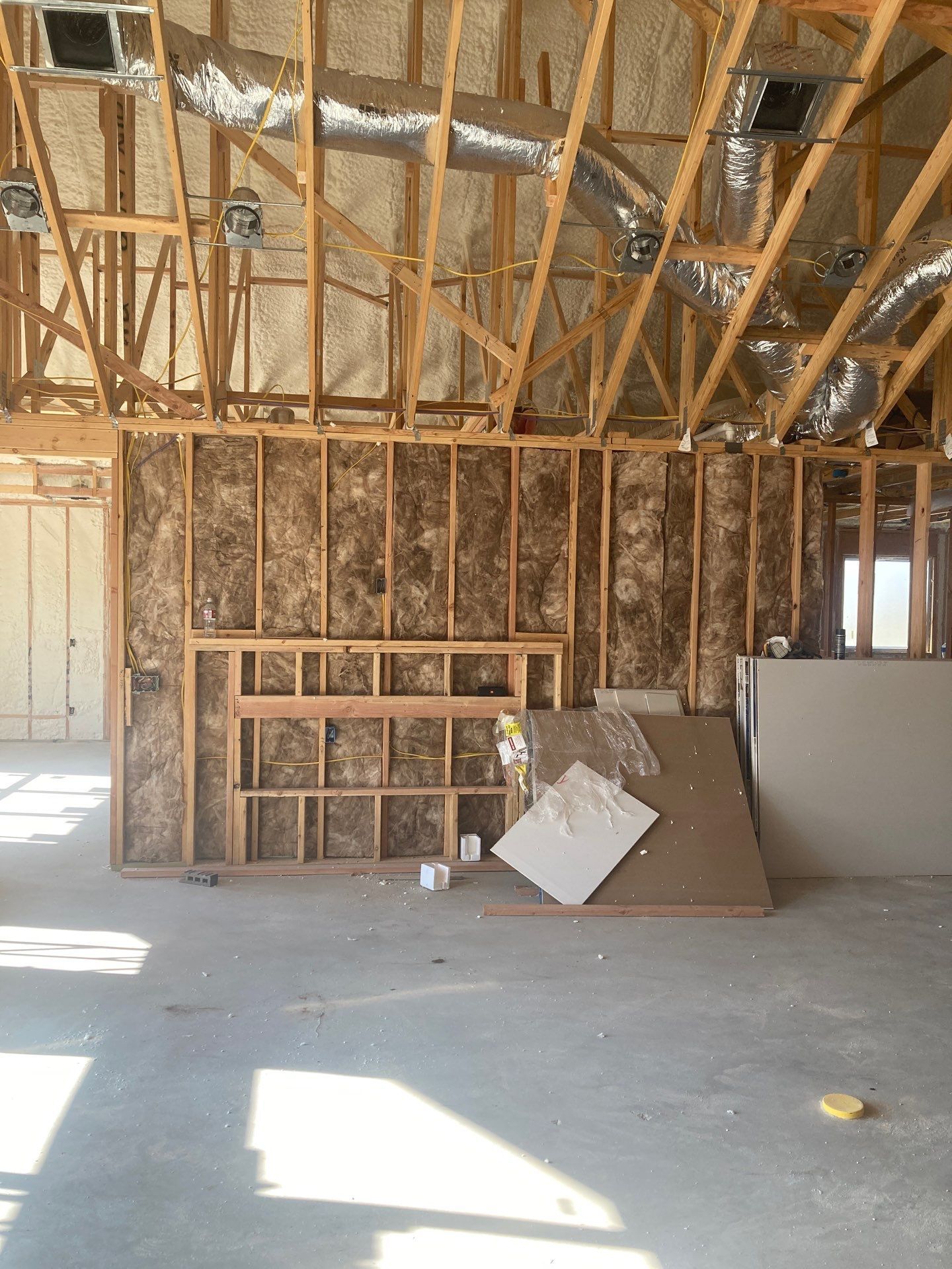 A building under construction with a lot of wooden beams