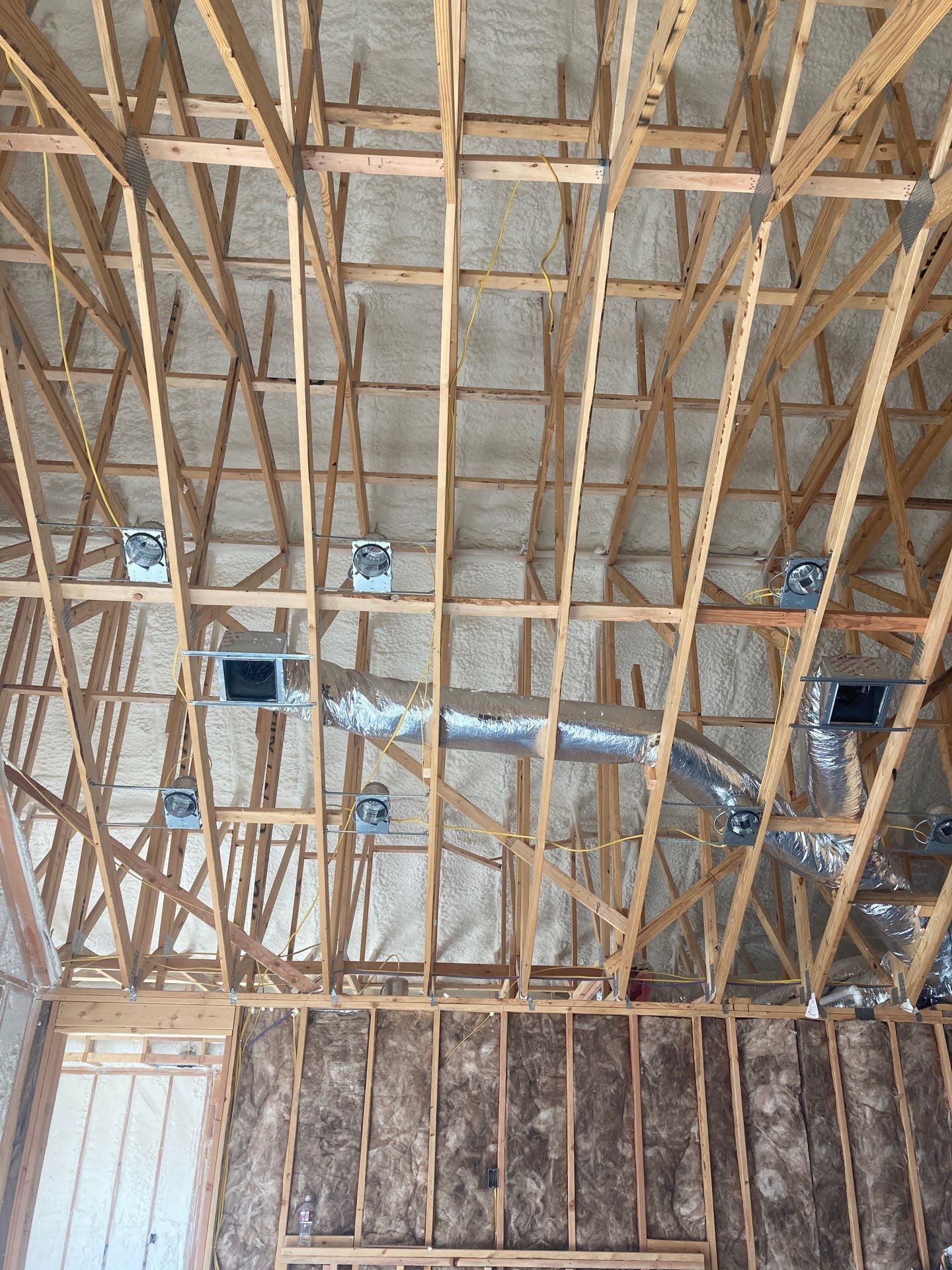 A picture of the ceiling of a building under construction.