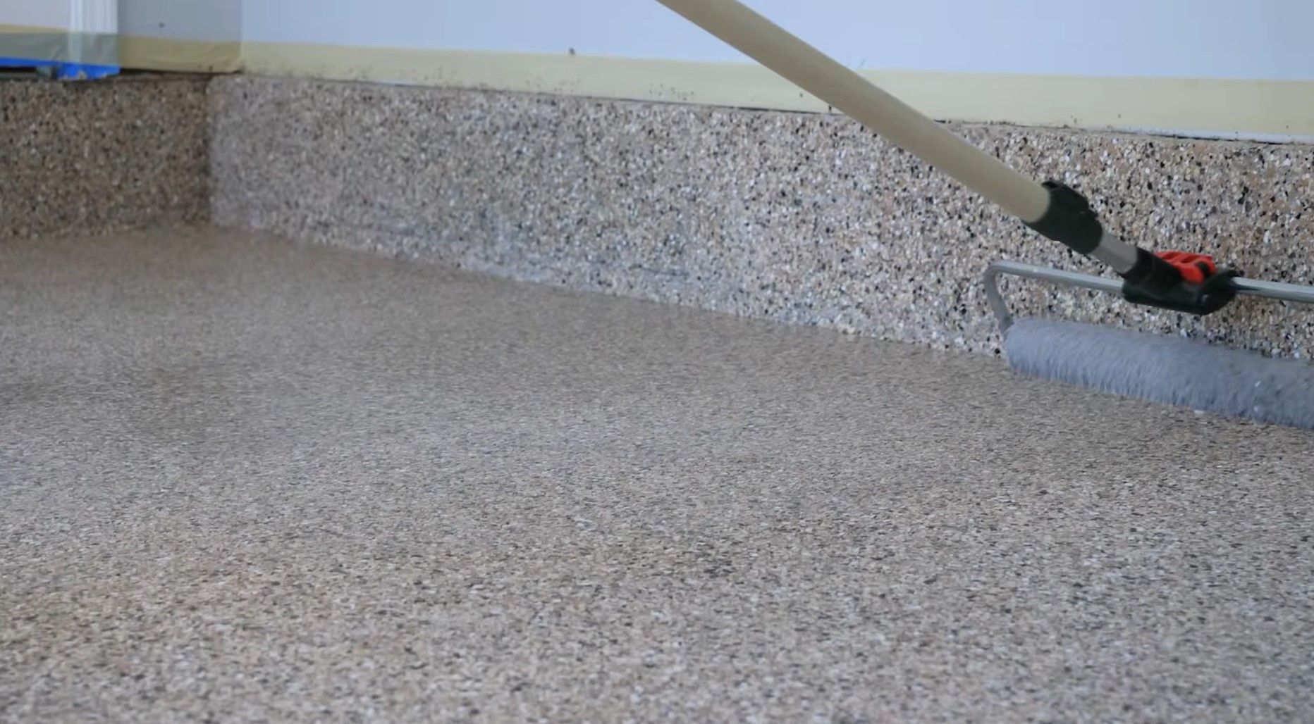 applying top transparent topcoat over epoxy flake floors