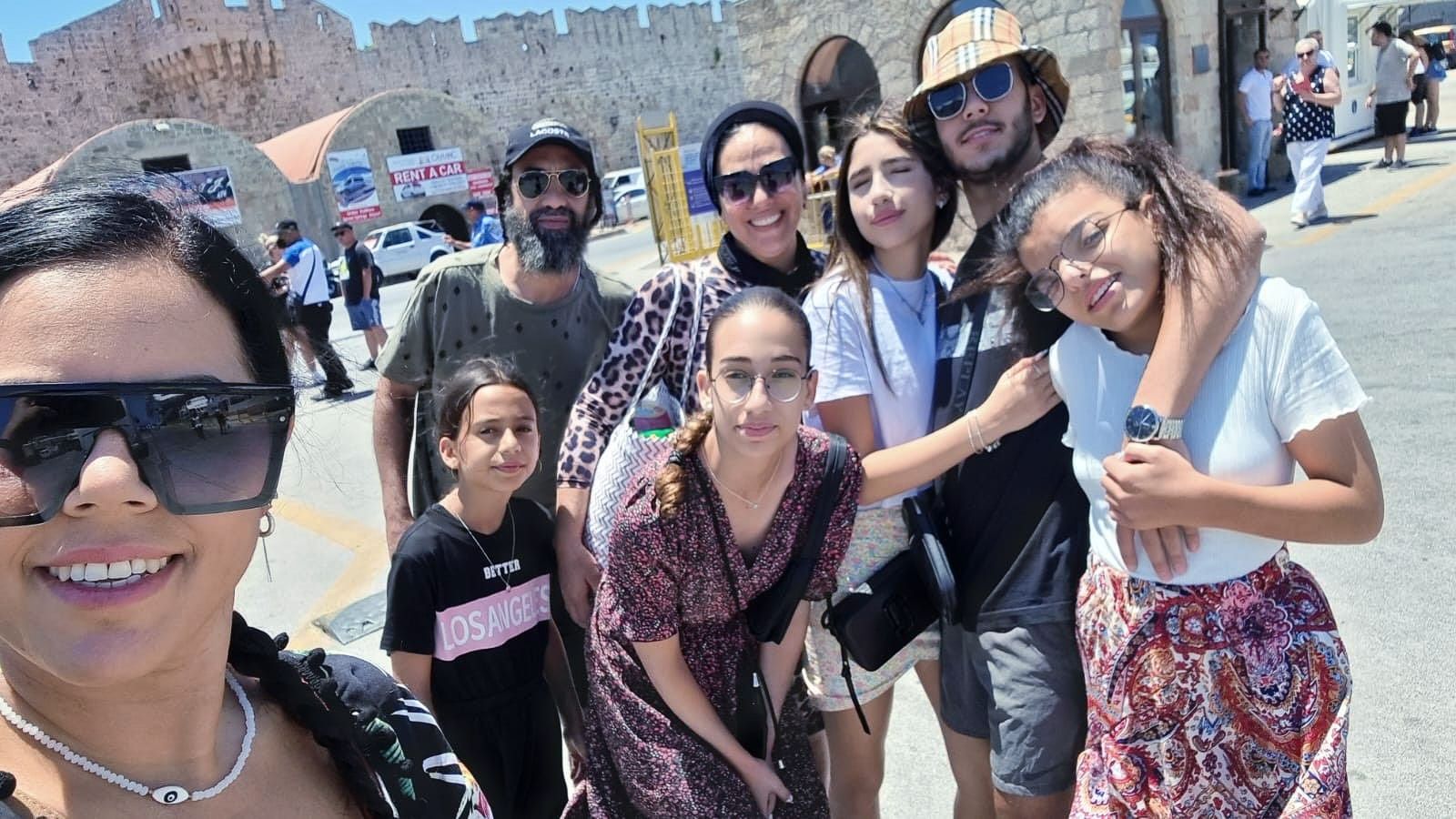 A group of people are posing for a picture together.