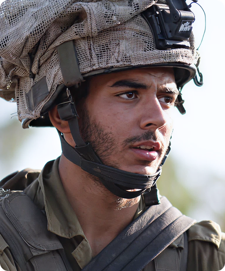 A close up of a soldier wearing a helmet