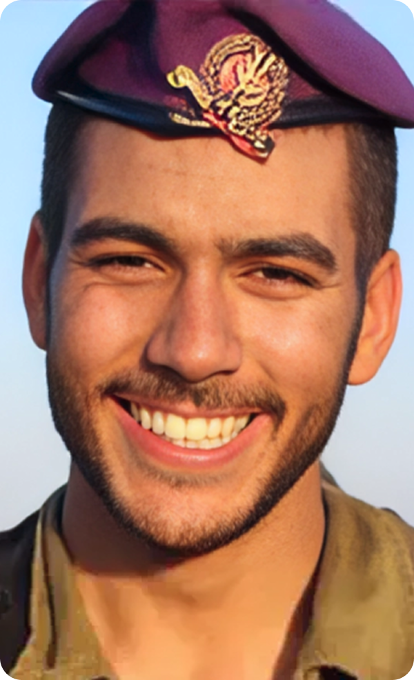 A man wearing a purple hat is smiling for the camera