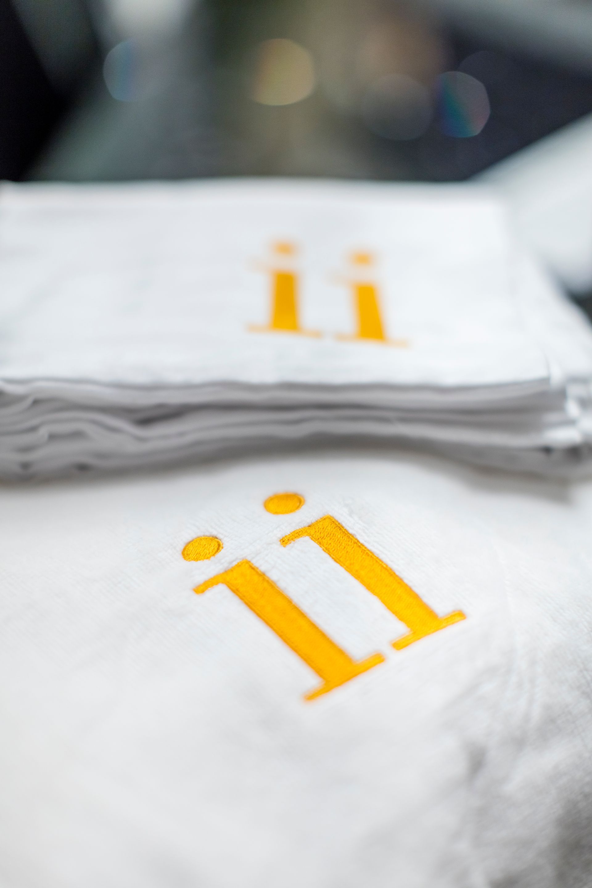 Close up of a while towl with the letters ii