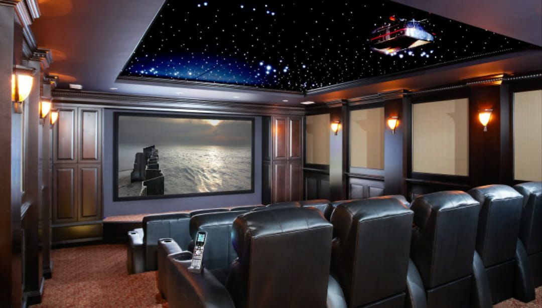 A home theater with a picture of a couple on the screen