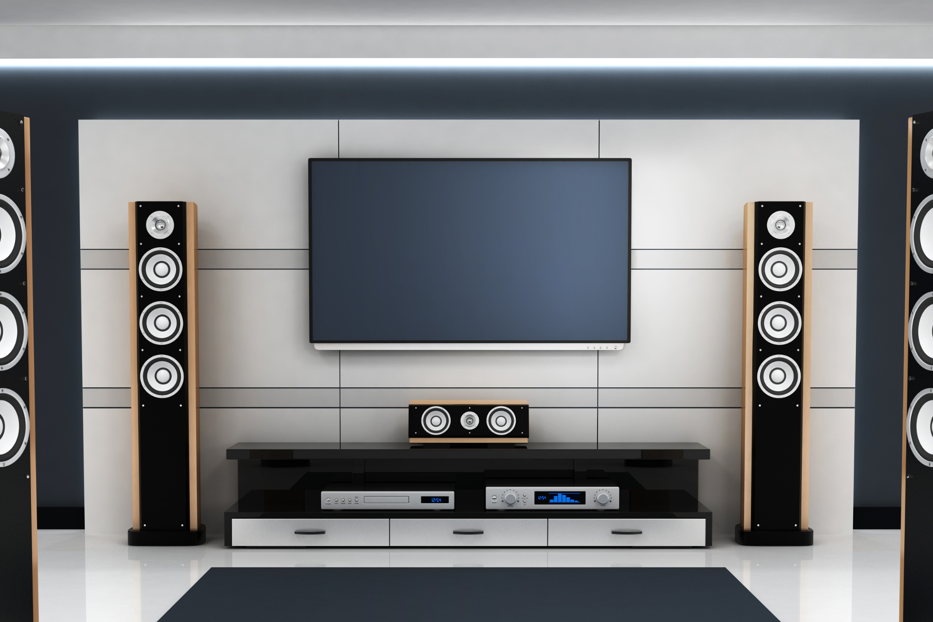 A living room with a flat screen tv and speakers