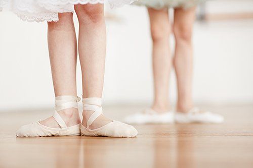 Dance Shoes — Kids Feet Wearing Dance Shoes for Ballerina in Hummelstown, PA