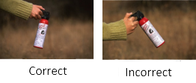 Two photos. Correct way to hold a fire extinguisher (upright) and Incorrect (angled).