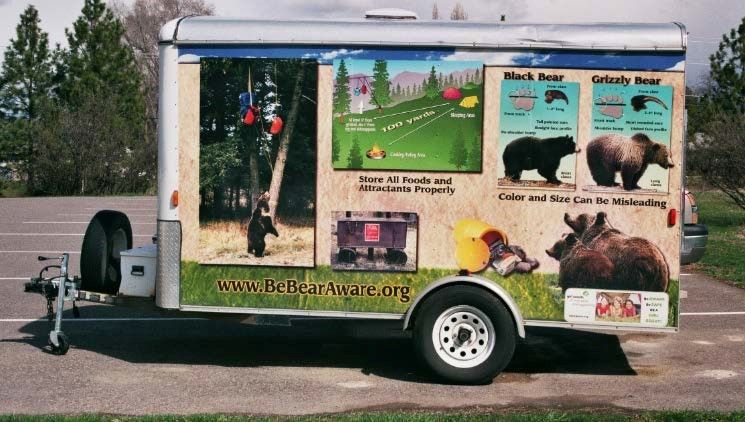 A trailer with educational panels about bears. 