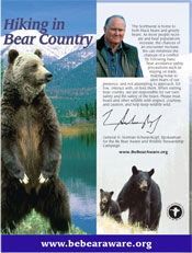 Ad: Hiking in Bear Country. Grizzly bear, black bear family, man, text, website.