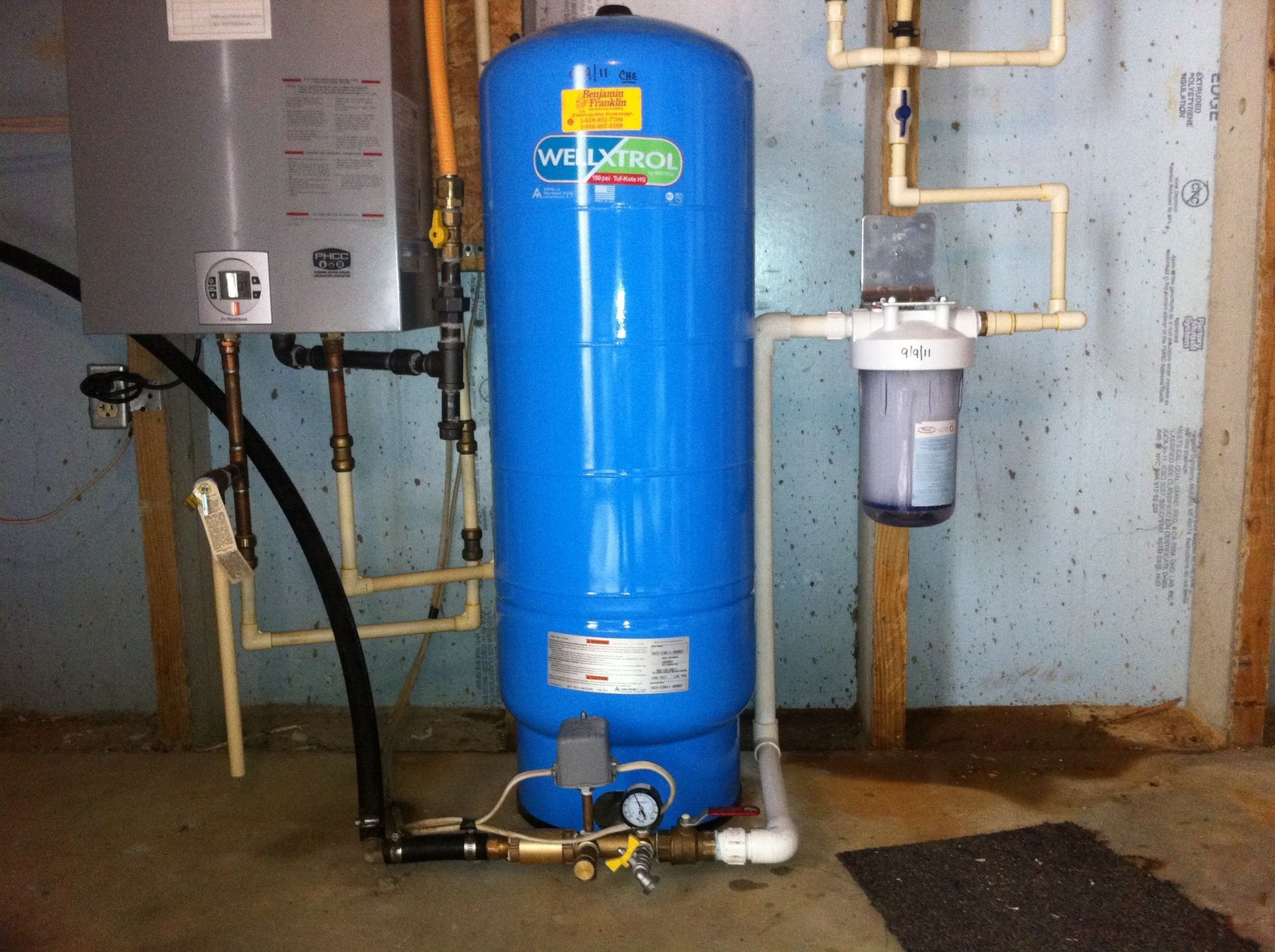 A blue water tank with the word miratech on it