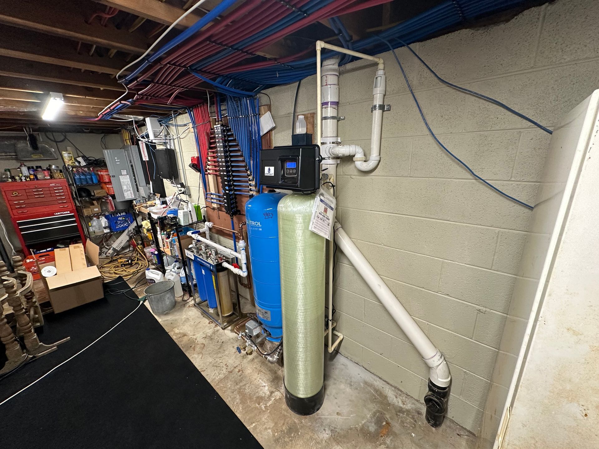 There is a water filter in the basement of a house.