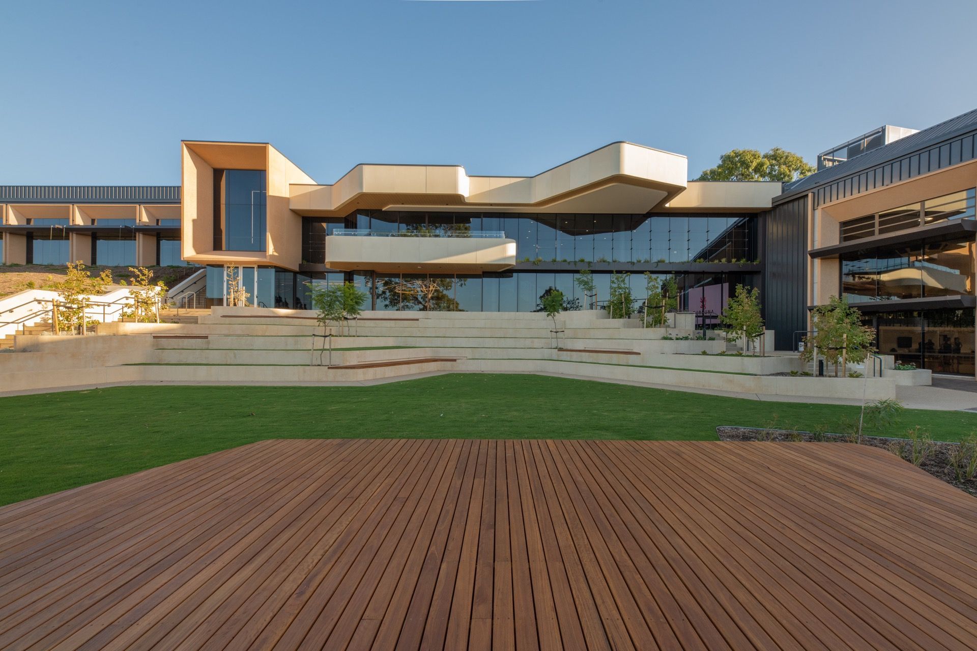 A large building with a wooden deck in front of it.
