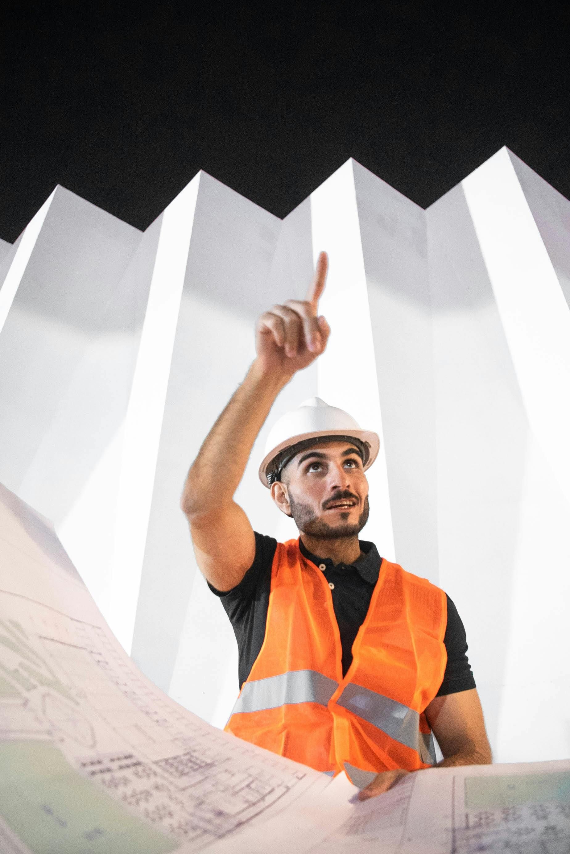 Two men are working on the roof of a building.