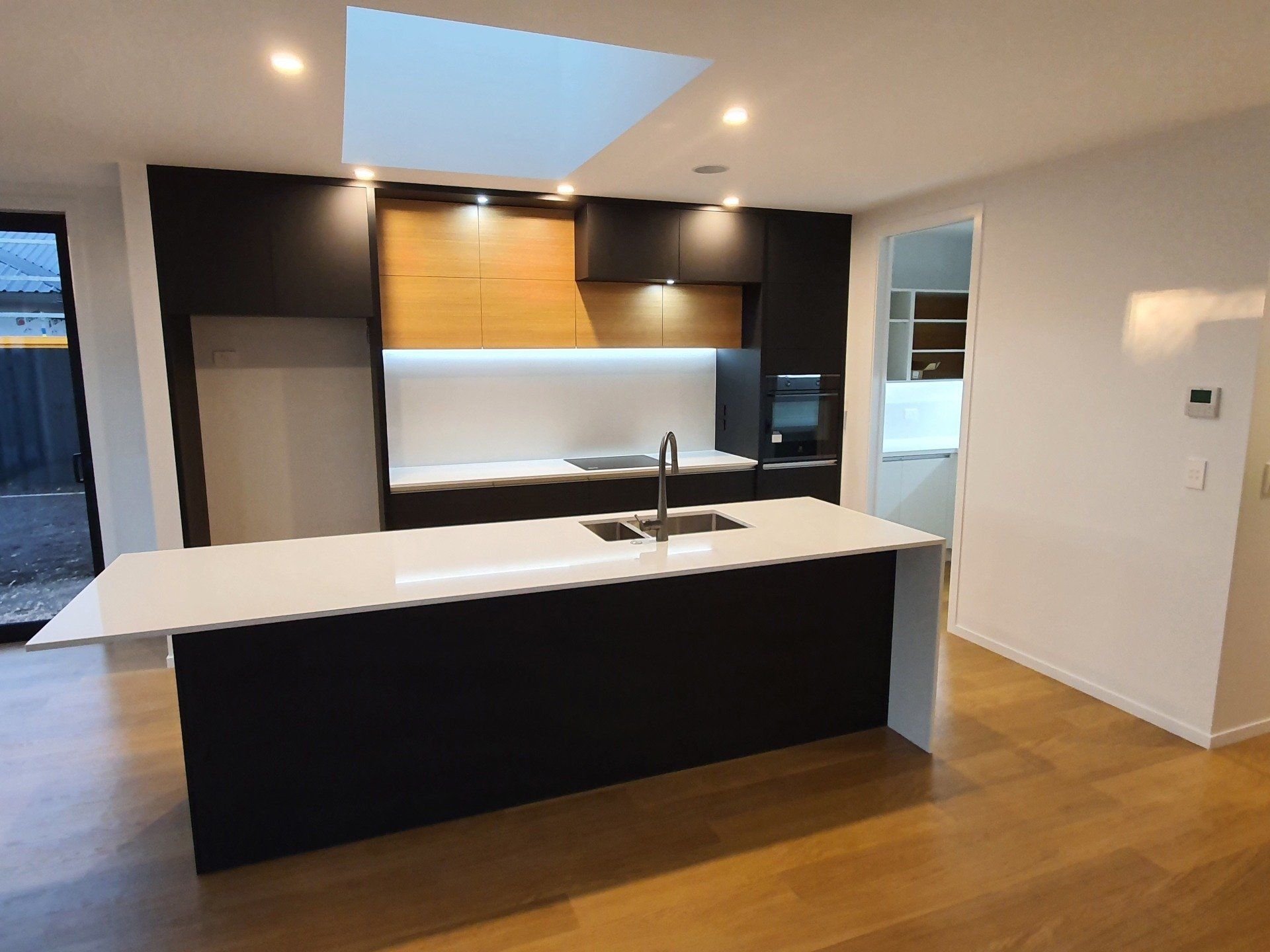 A kitchen with a large island and a sink