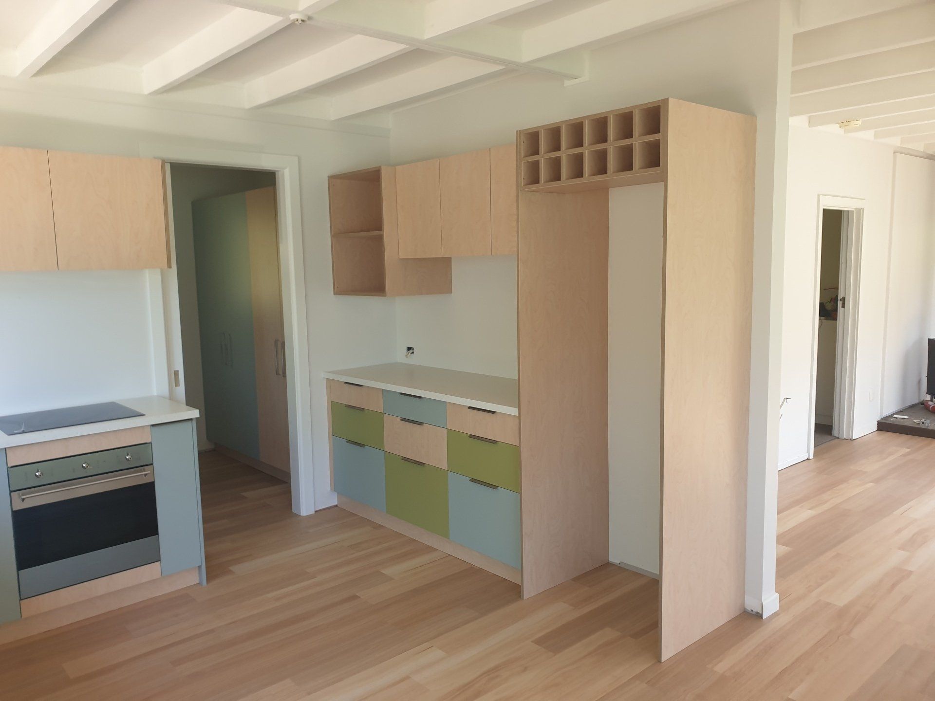 A kitchen with wooden cabinets and a stove top oven