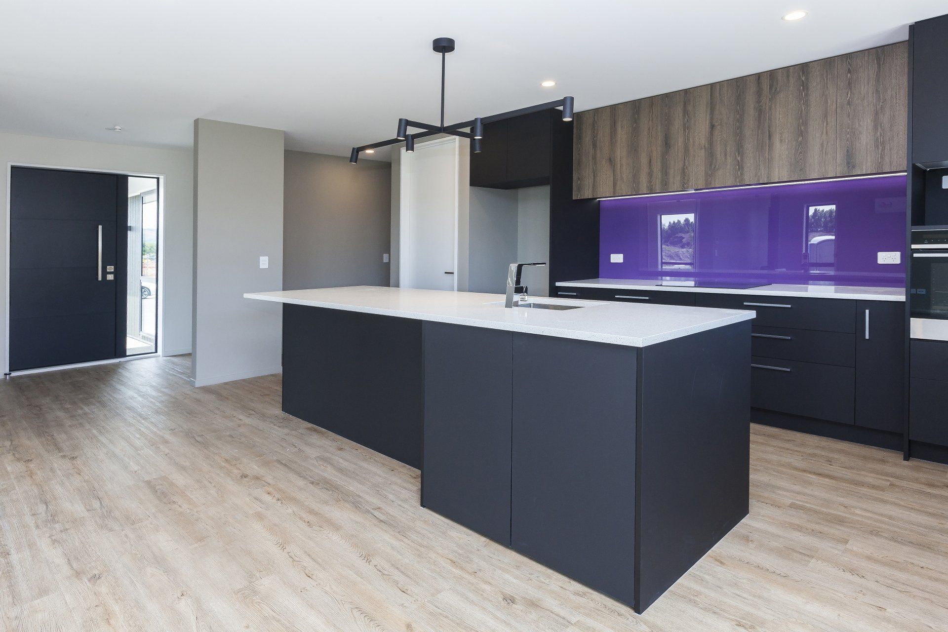 There is a large island in the middle of the kitchen.