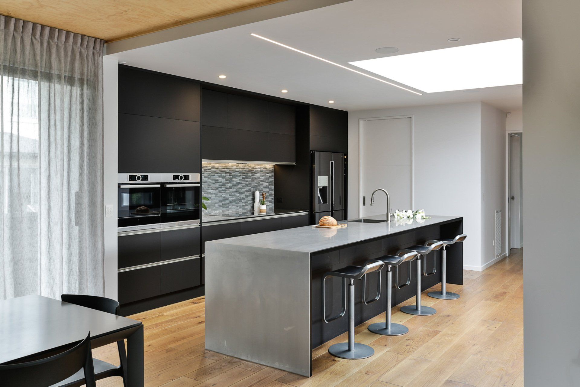 There is a large island in the middle of the kitchen.