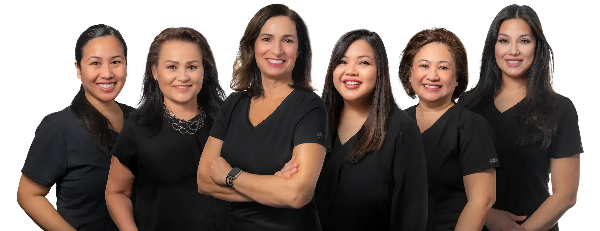 A group of women in black scrubs are posing for a picture.