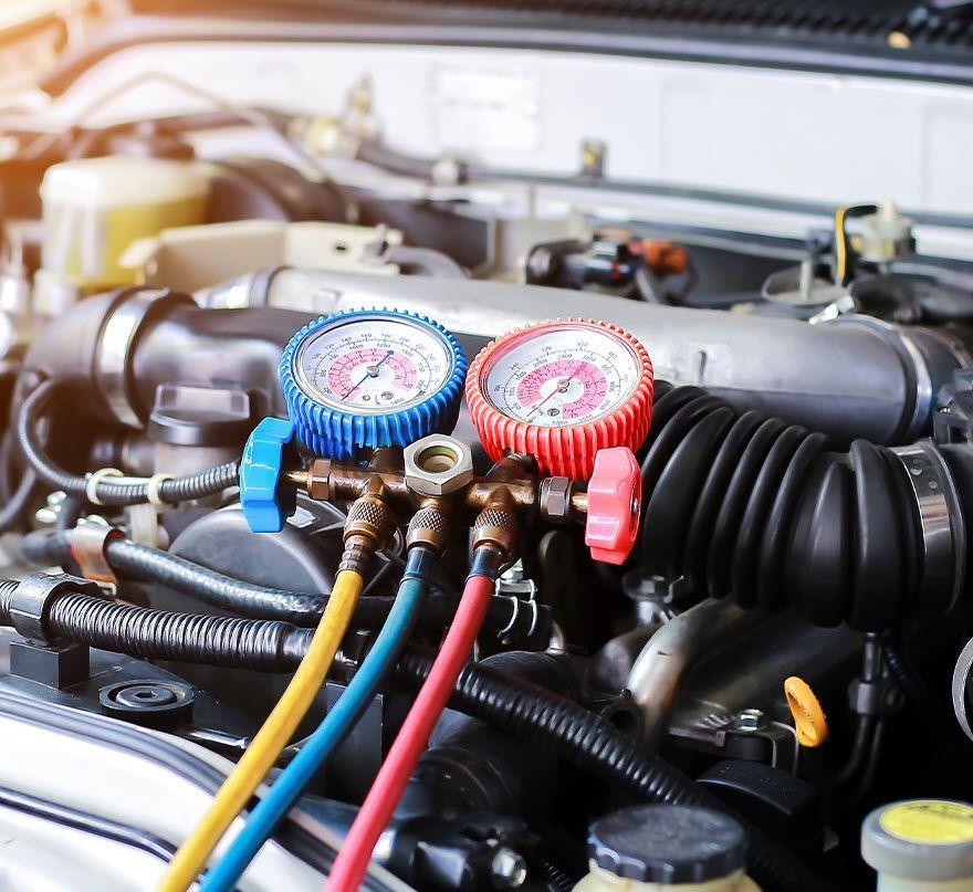 A close up of a car engine with a bunch of gauges on it | TIRE NATION & AUTO REPAIR POINT S