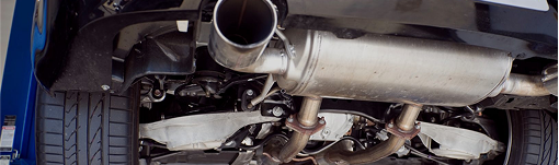A close up of the underside of a car with a exhaust pipe. | TIRE NATION & AUTO REPAIR POINT S