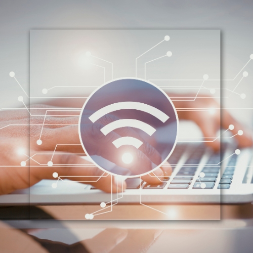 Person typing on a laptop, overlaid with a Wi-Fi symbol and digital circuit lines.