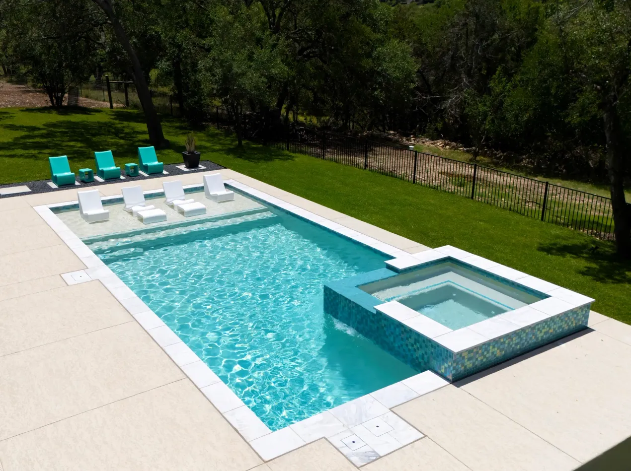 Happy pool construction customer in new swimming pool. Happy pool construction customer in new swimming pool.