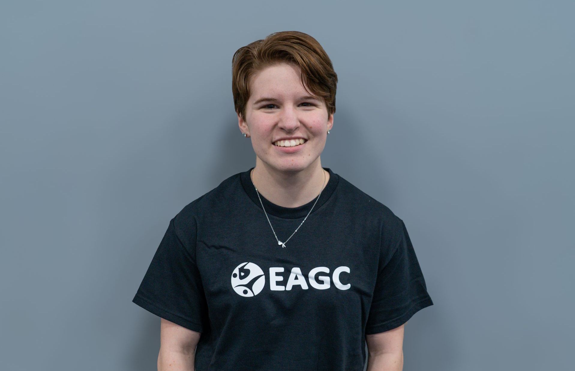 A Female Rec Coach wearing a black EAGC Tshirt