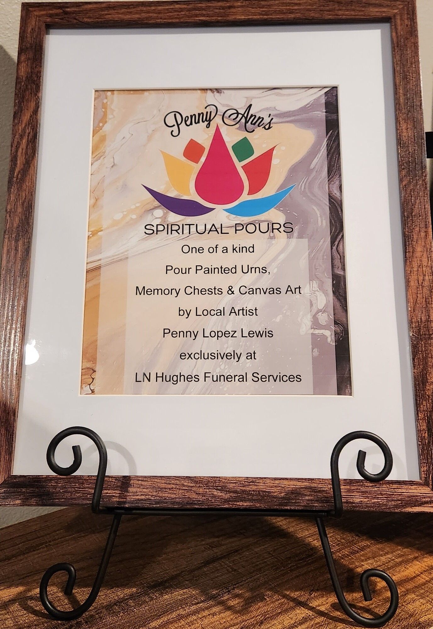 Framed artwork on a stand with the text 