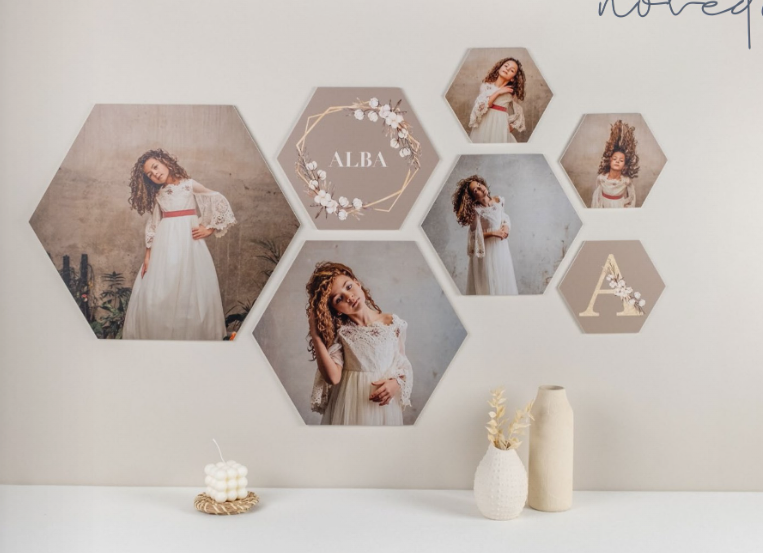 Un collage de fotografías de una niña con un vestido blanco en una pared.