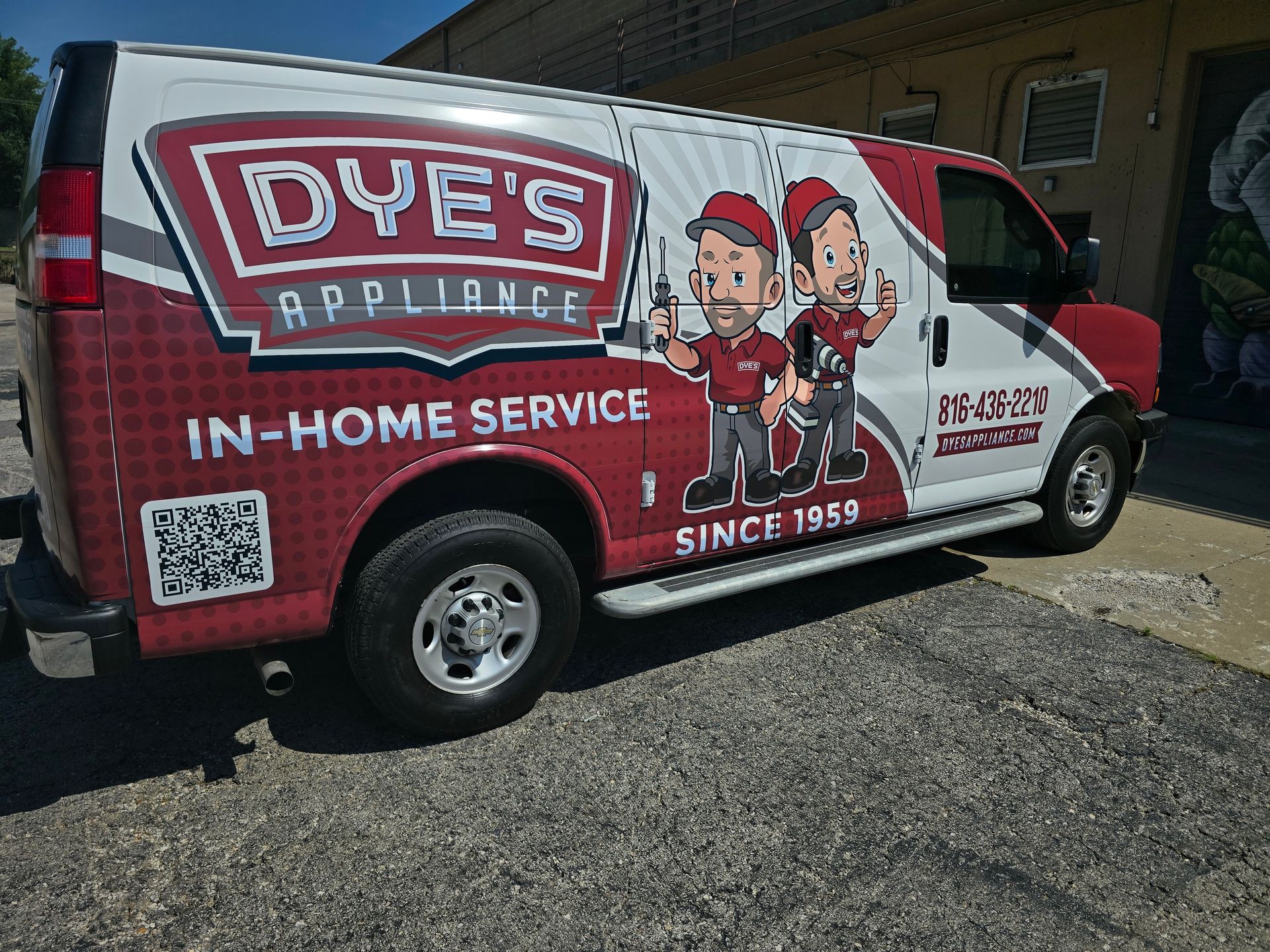 Dye's Appliances branded truck sitting in front of a house
