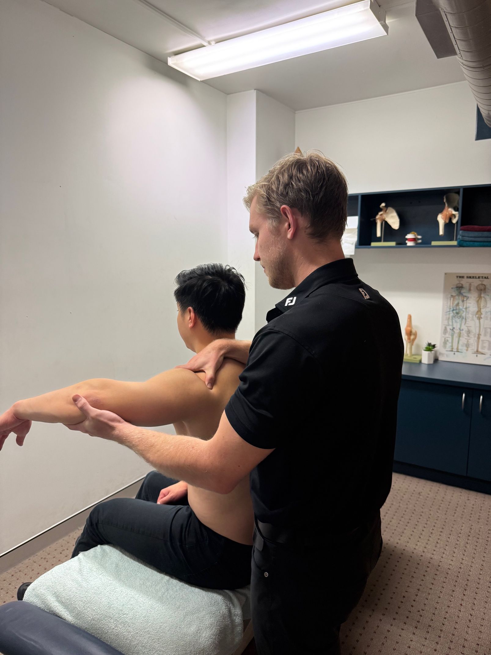A Man Using Pressure Points on an Arm— Spinal Symmetry In Salamander Bay, NSW