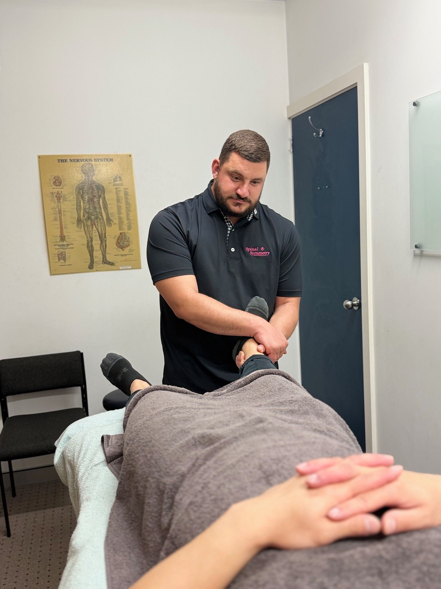A Practitioner manipulating the feet — Spinal Symmetry In Salamander Bay, NSW