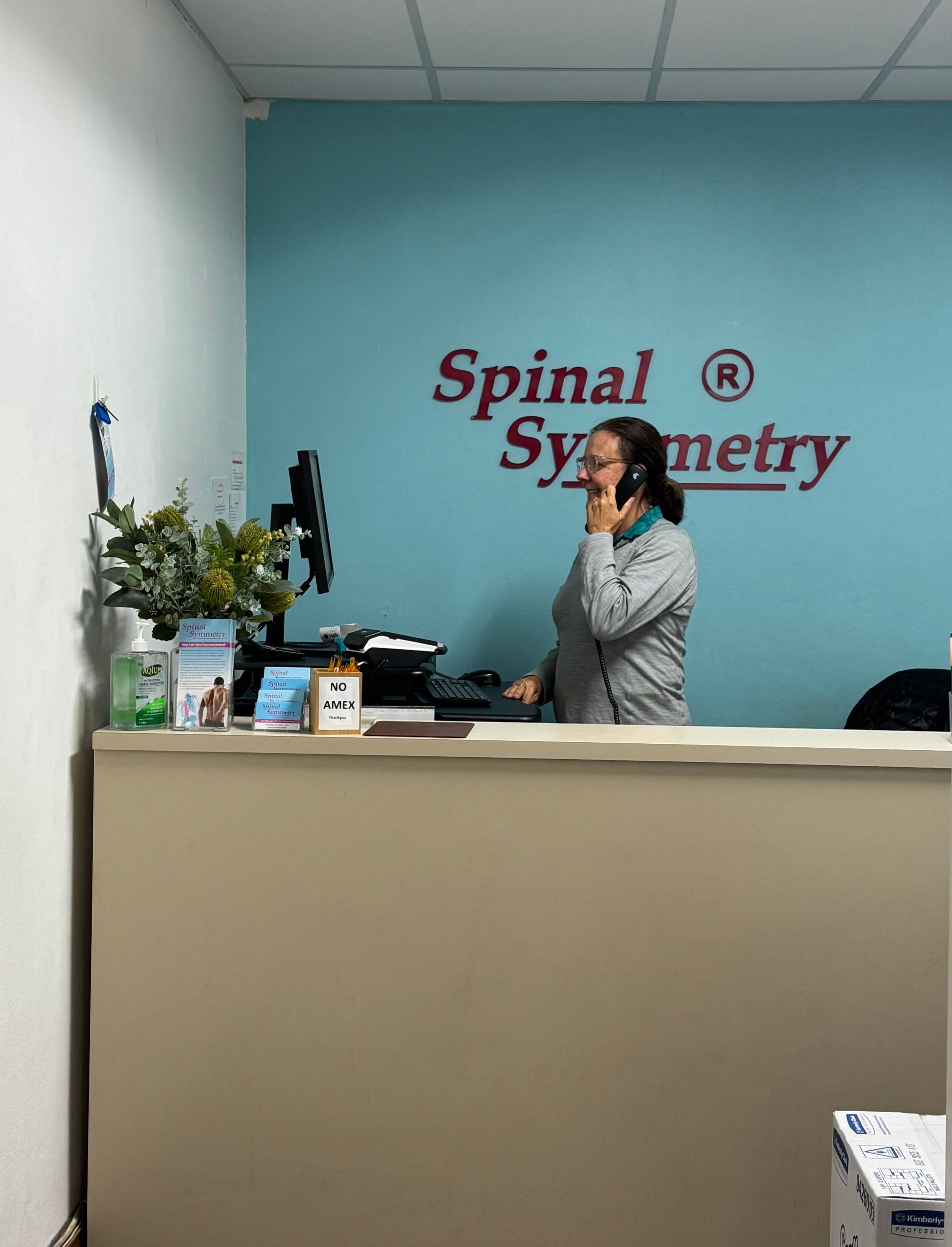 A Healthcare Provider Manipulates a Patient's Arm — Spinal Symmetry In Dee Why, NSW