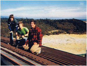 A group of people are working on a roof.