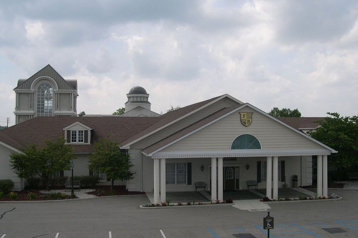 Several photos of interior and exterior facilities of Flanner Buchanan Washington Park East Location in Indianapolis, IN