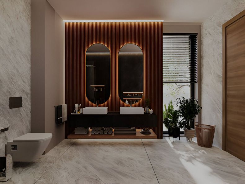 Modern bathroom with double sinks, oval mirrors, and wood paneling. Includes a toilet and plants.