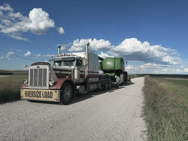 Heavy duty tow truck recovering a semi truck on Lethbridge highway