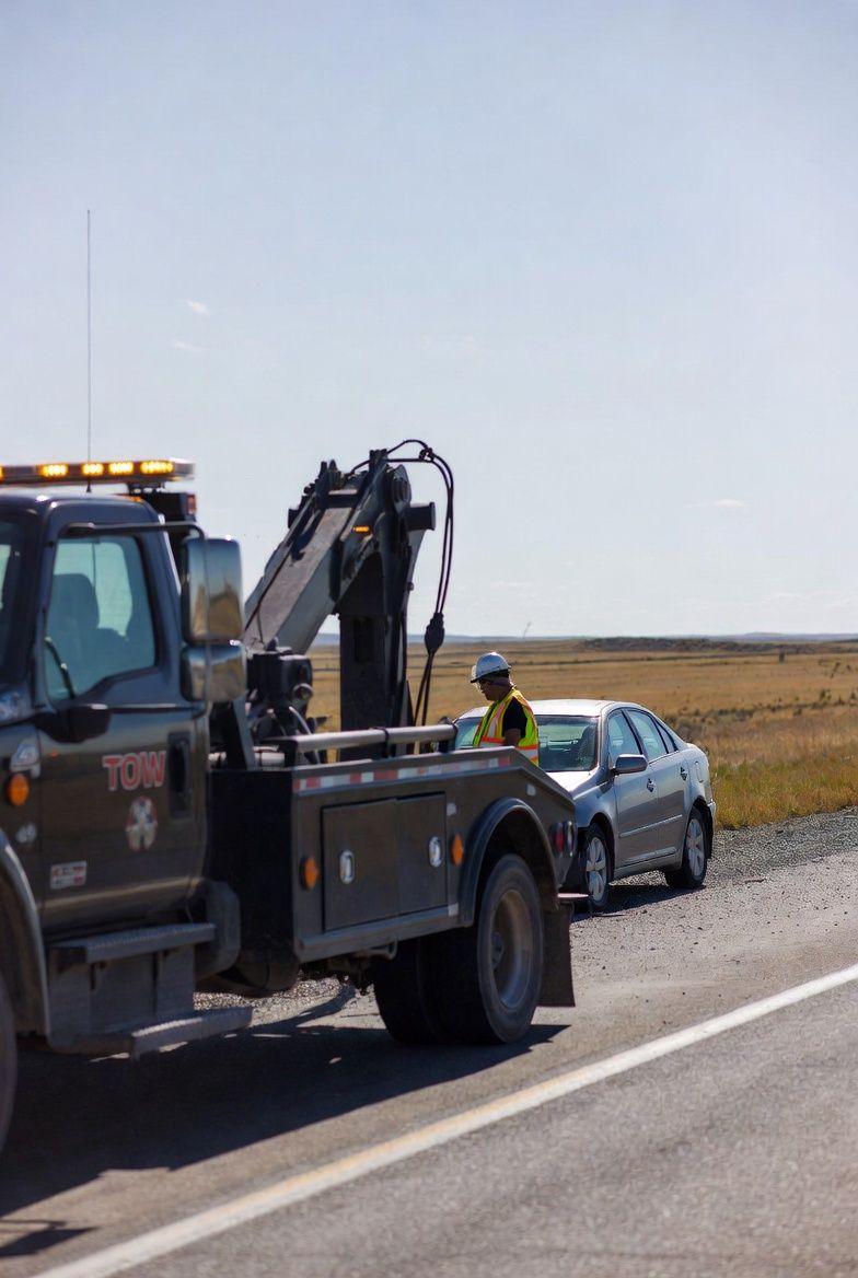 Driver receiving roadside help after unexpected vehicle trouble