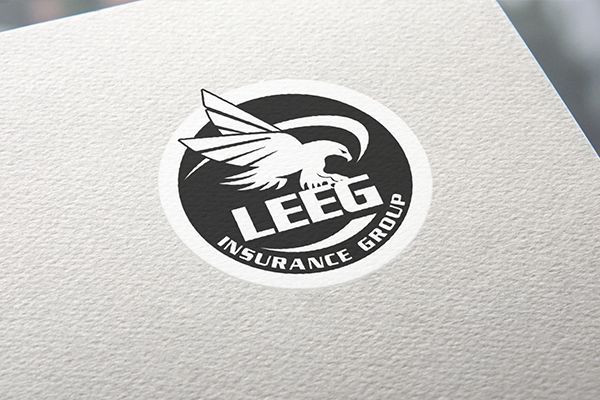 Black and white logo: eagle with spread wings inside a circle, text 