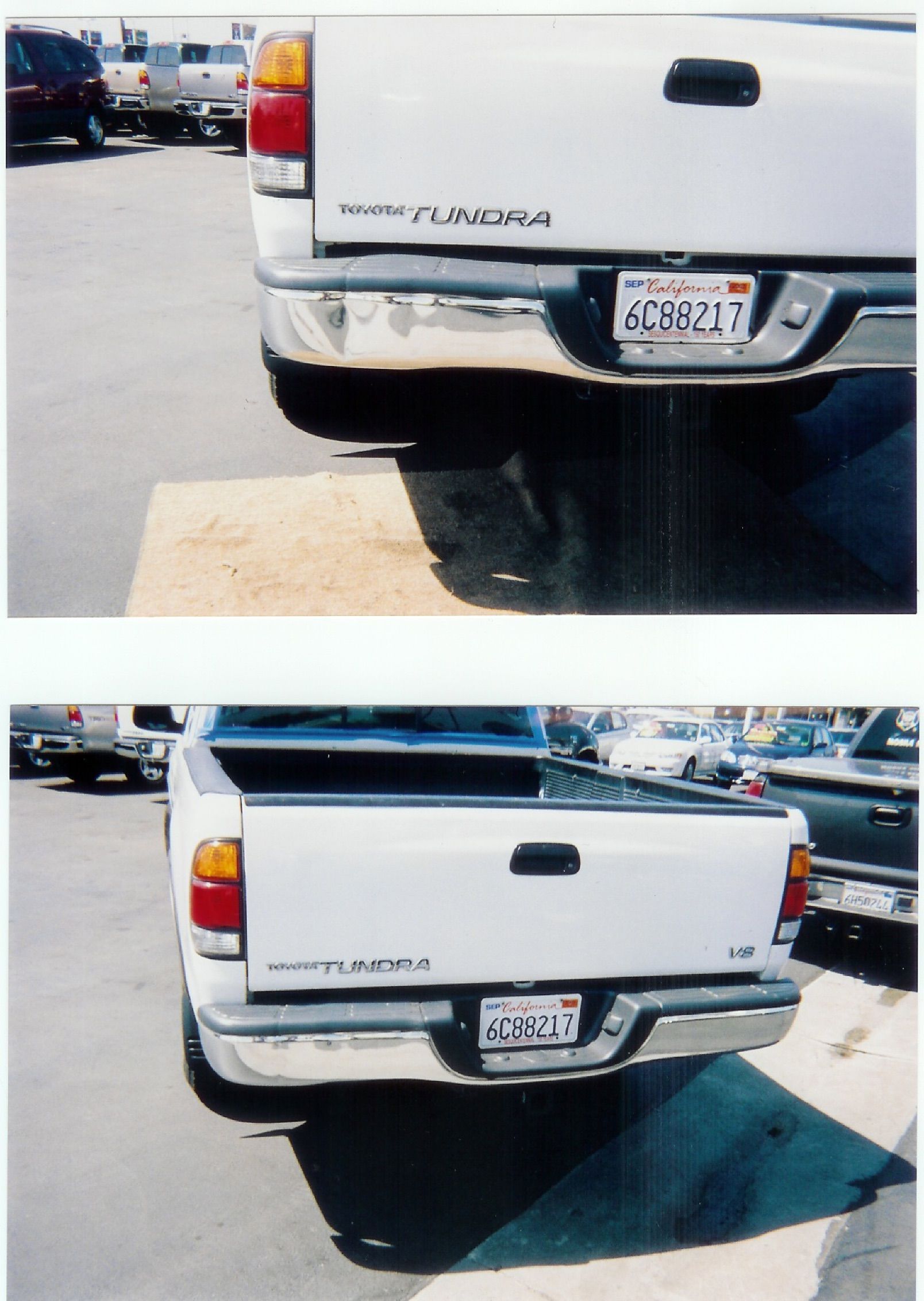 Blue semi-trucks parked in a lot, other trucks visible in the background, under a slightly overcast sky.