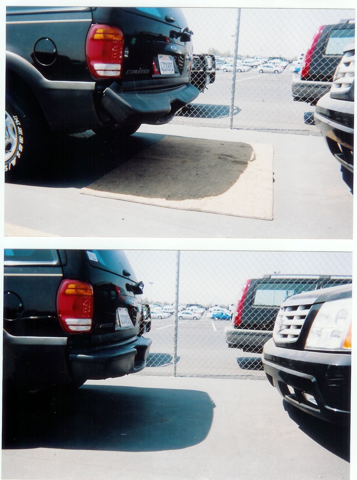 Red car with significant rear-end damage on the side of a road; sunny day.