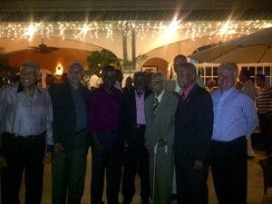 A group of men are posing for a picture together.