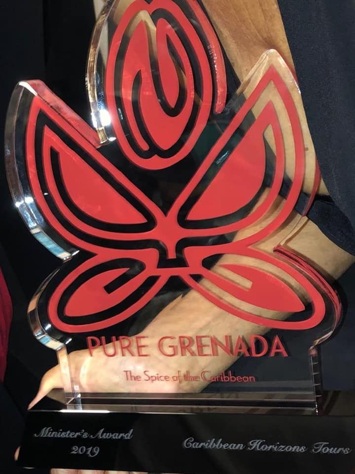 A trophy that says pure grenada on it